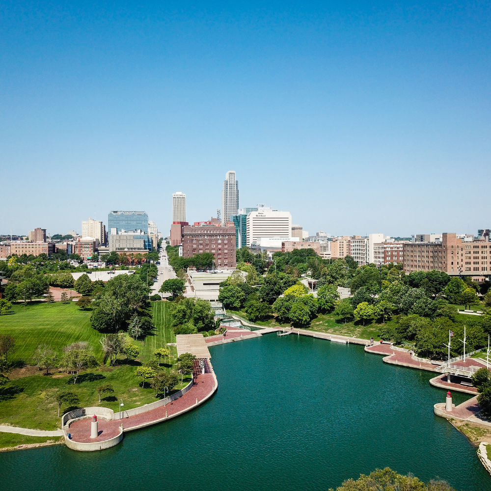 City skyline with a park and lake on a clear day