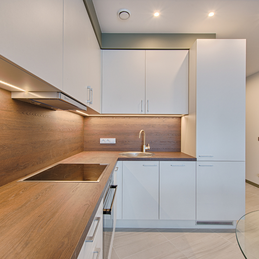 Kitchen showcasing cozy cabinets and counter top.